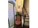 Staircase with a privacy screen and chair, offering a blend of functionality and style at 1604 Haven Cir, Douglasville, GA 30135