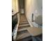 Carpeted stairs showcasing a chair lift for convenience and safety at 1604 Haven Cir, Douglasville, GA 30135