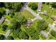 An aerial view of a home surrounded by lush greenery, a lawn, and a neighborhood at 3888 Lindley Cir, Powder Springs, GA 30127