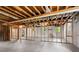 Unfinished basement showing the studded walls and ceiling rafters offering customization and expansion possibilities at 3888 Lindley Cir, Powder Springs, GA 30127