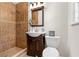 Bathroom with tiled shower, toilet and vanity at 3888 Lindley Cir, Powder Springs, GA 30127
