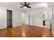 Bedroom features hardwood floors, ceiling fan, closet, and access to bathroom at 3888 Lindley Cir, Powder Springs, GA 30127