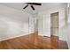 Bedroom features hardwood floors, neutral paint, ceiling fan, and closet at 3888 Lindley Cir, Powder Springs, GA 30127