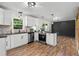 Updated kitchen with stainless steel appliances and modern countertops is perfect for culinary enthusiasts at 3888 Lindley Cir, Powder Springs, GA 30127