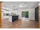 Modern kitchen featuring white cabinets, stainless steel appliances, and an island with bar seating at 3888 Lindley Cir, Powder Springs, GA 30127