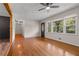 Bright living room featuring hardwood floors, large windows, and an open entryway at 3888 Lindley Cir, Powder Springs, GA 30127