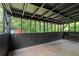 Enclosed and covered patio with views of the backyard is great for outdoor entertainment at 3888 Lindley Cir, Powder Springs, GA 30127
