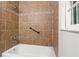 Nicely tiled shower with shower head and grab bar at 3888 Lindley Cir, Powder Springs, GA 30127