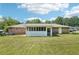 Spacious backyard featuring the sunroom and a well-maintained lawn, perfect for outdoor enjoyment at 6160 King Arthur Dr, Douglasville, GA 30135