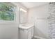 Modern bathroom with a white vanity, marble countertops, and an updated shower at 6160 King Arthur Dr, Douglasville, GA 30135