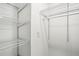 A walk-in closet with wire shelving and a hanging rod for optimal storage at 6160 King Arthur Dr, Douglasville, GA 30135
