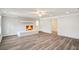 Cozy living room with a white painted brick fireplace and hardwood floors at 6160 King Arthur Dr, Douglasville, GA 30135