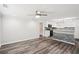 An open-concept living space with a view of the kitchen, showcasing modern appliances and stylish design at 6160 King Arthur Dr, Douglasville, GA 30135