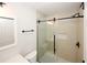 Well-lit bathroom featuring a glass-enclosed shower with modern fixtures at 662 Gary Nw Rd, Atlanta, GA 30318
