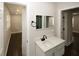 Bright bathroom featuring modern fixtures, a large vanity, and sleek design at 662 Gary Nw Rd, Atlanta, GA 30318