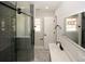 Spacious bathroom featuring a glass shower and vanity with black fixtures at 662 Gary Nw Rd, Atlanta, GA 30318