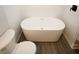 Modern bathroom featuring a standalone tub, white subway tile, and toilet at 662 Gary Nw Rd, Atlanta, GA 30318