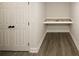 Hallway nook with a built-in desk, storage closet, and attractive vinyl floors at 662 Gary Nw Rd, Atlanta, GA 30318