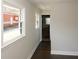 Bright hallway with wood floors, and lots of natural light and leads to the bathroom at 662 Gary Nw Rd, Atlanta, GA 30318