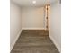 Basement hallway with a finished floor and access to other areas at 662 Gary Nw Rd, Atlanta, GA 30318