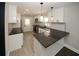 Modern kitchen featuring white cabinets, stainless steel appliances, and stylish countertops at 662 Gary Nw Rd, Atlanta, GA 30318