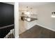 Modern kitchen with white cabinets, stainless steel appliances, and sleek countertops at 662 Gary Nw Rd, Atlanta, GA 30318