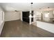 Bright and airy living space with hardwood floors, sleek lighting, and open layout to the kitchen at 662 Gary Nw Rd, Atlanta, GA 30318
