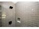 Modern shower featuring sleek gray subway tiles and a built-in niche at 662 Gary Nw Rd, Atlanta, GA 30318