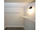 Walk-in closet with wire shelving and overhead lighting at 662 Gary Nw Rd, Atlanta, GA 30318