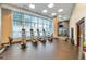 Fitness center with state-of-the-art exercise equipment and large windows offering cityscape views at 1080 Peachtree Ne St # 1208, Atlanta, GA 30309