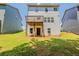 Back of home with a small wood deck, and a door leading to the backyard at 173 Parkview Place Dr, Mcdonough, GA 30253