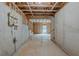 Unfinished basement with exposed beams, concrete walls, and visible utilities at 173 Parkview Place Dr, Mcdonough, GA 30253