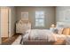 Cozy bedroom with neutral walls, plush carpet, and a bright window at 173 Parkview Place Dr, Mcdonough, GA 30253