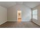 Carpeted bedroom featuring an ensuite bath and bright, neutral paint at 173 Parkview Place Dr, Mcdonough, GA 30253