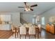 Inviting dining room featuring stylish furnishings, a ceiling fan, and hardwood floors at 173 Parkview Place Dr, Mcdonough, GA 30253