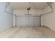 Spacious garage with concrete floor and a white sectional garage door at 173 Parkview Place Dr, Mcdonough, GA 30253