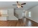 Open-concept living area featuring hardwood floors, recessed lighting, and a staircase at 173 Parkview Place Dr, Mcdonough, GA 30253