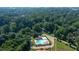 Community aerial view featuring baseball fields, a pool, and a tree-lined neighborhood providing amenities at 2343 Hunting Valley Dr, Decatur, GA 30033