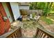 Cozy back patio area featuring outdoor seating, stone pavers, and a wooden privacy fence at 2343 Hunting Valley Dr, Decatur, GA 30033