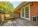 Back deck with wood railings and brick exterior at 2343 Hunting Valley Dr, Decatur, GA 30033