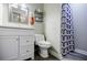 Bathroom with a white vanity, modern fixtures, and decorative shower curtain at 2343 Hunting Valley Dr, Decatur, GA 30033
