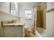 Bathroom features granite counters, beadboard walls, and a shower over tub with tile at 2343 Hunting Valley Dr, Decatur, GA 30033