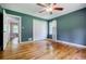Bedroom with hardwood floors, neutral walls, bi-fold closet doors, and a window at 2343 Hunting Valley Dr, Decatur, GA 30033