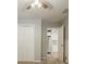Carpeted bedroom with closet and adjacent kitchen at 2343 Hunting Valley Dr, Decatur, GA 30033
