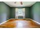 Bedroom with hardwood floors, neutral walls, a ceiling fan, and a bright window at 2343 Hunting Valley Dr, Decatur, GA 30033
