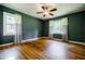 Spacious bedroom with hardwood floors, ceiling fan, and windows with bright natural light at 2343 Hunting Valley Dr, Decatur, GA 30033