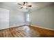 Bedroom boasts hardwood floors, neutral walls, ceiling fan and natural light at 2343 Hunting Valley Dr, Decatur, GA 30033