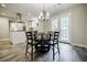 Dining area with a glass-top table next to the kitchen and french doors at 2343 Hunting Valley Dr, Decatur, GA 30033