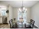 Dining area with a glass-top table and views into the kitchen at 2343 Hunting Valley Dr, Decatur, GA 30033