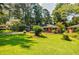 Well-maintained brick home with a lush green lawn and mature shade trees at 2343 Hunting Valley Dr, Decatur, GA 30033